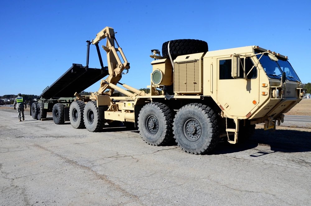 U.S. Army heavy tactical truck with a load-handling arm
